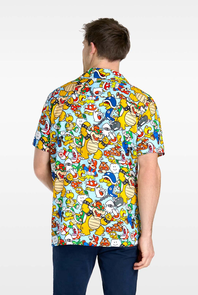 Man wearing Hawaiian shirt with Super Mario Icons