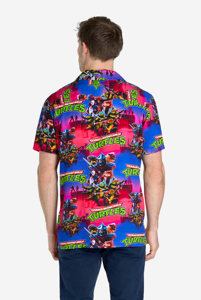 Man wearing Hawaiian Shirt with Teenage Mutant Ninja Turtle print.