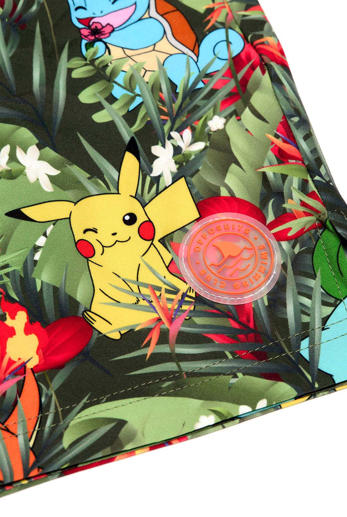 Man wearing swim trunks with Pokemon forest print, close up