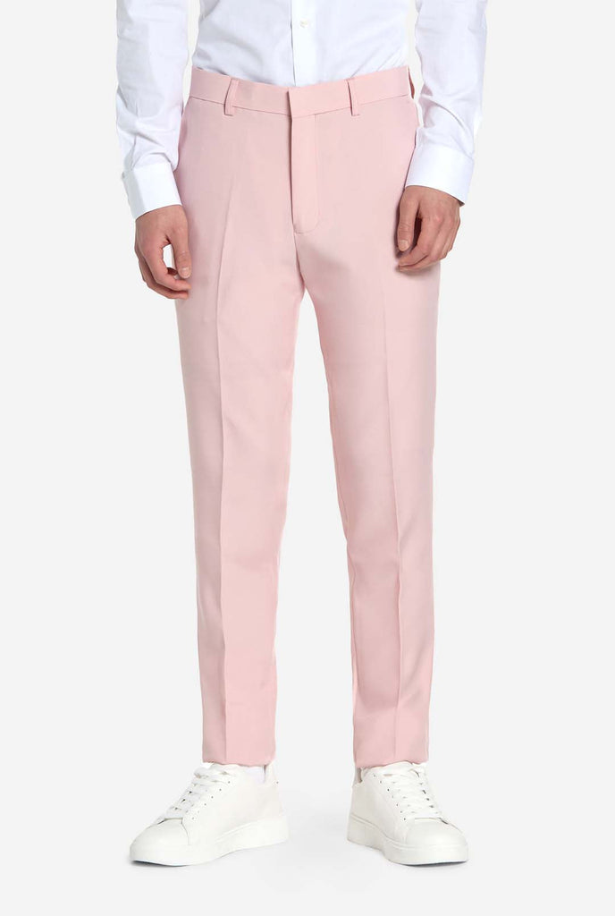 Teen wearing soft pink teen boys suit, pants view.