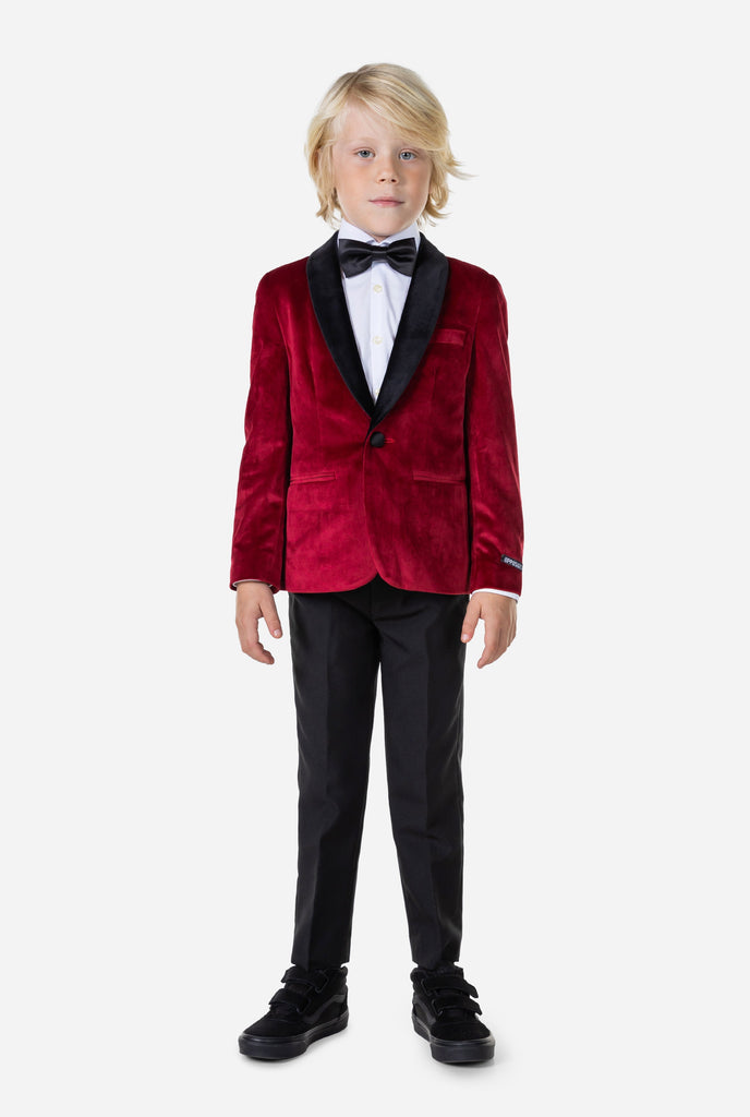 Boy wearing red velvet dinner jacket