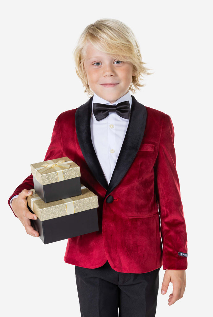 Boy wearing red velvet Christmas dinner jacket