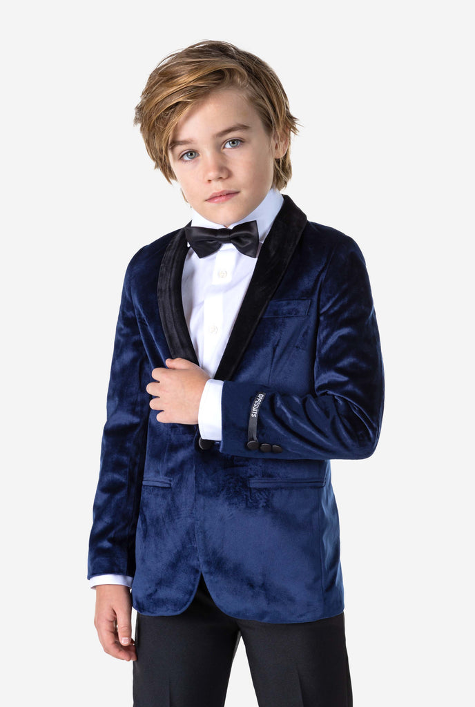 Boy wearing blue velvet Christmas dinner jacket