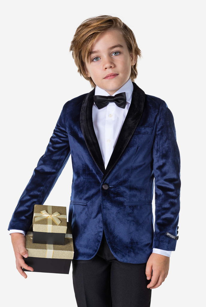 Boy wearing blue velvet Christmas dinner jacket