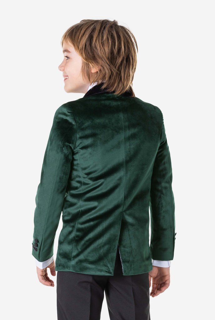 Boy wearing green velvet Christmas dinner jacket, view from the back