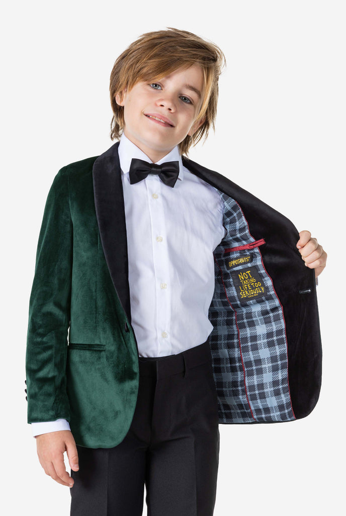 Boy wearing green velvet Christmas dinner jacket