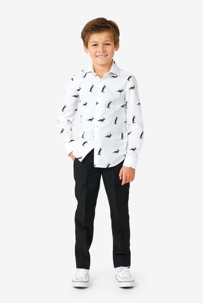 White Christmas dress shirt with Christmas penguins worn by a boy