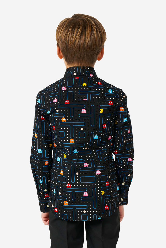 Boy wearing long sleeve boys' shirt with Pac-Man print from the back