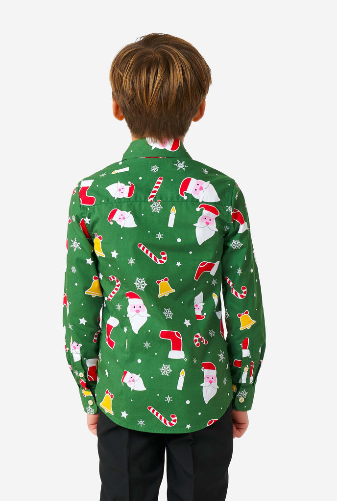 Kid wearing green Christmas shirt with Christmas icons, view from the back