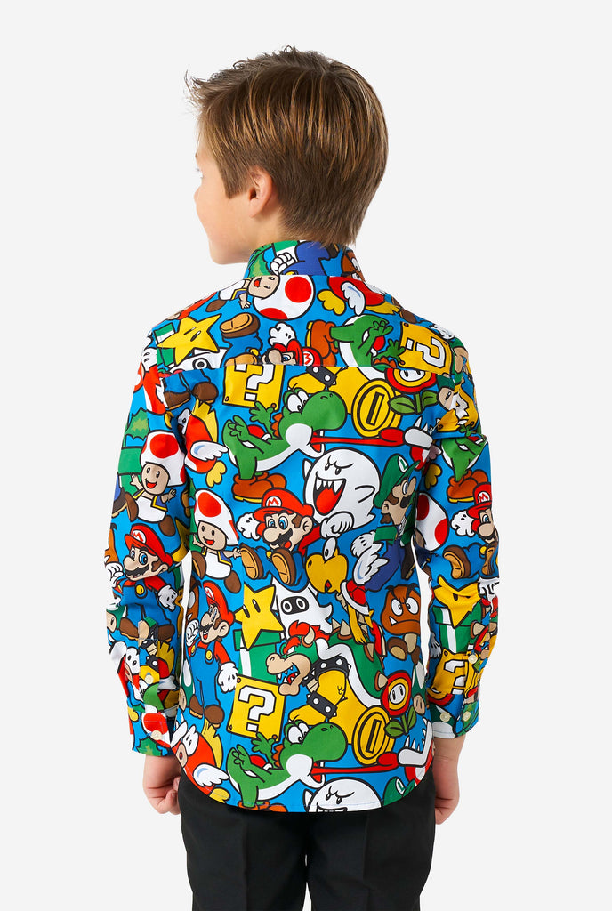 Boy wearing colorful long sleeve shirt with Super Mario Nintendo print, view from the back