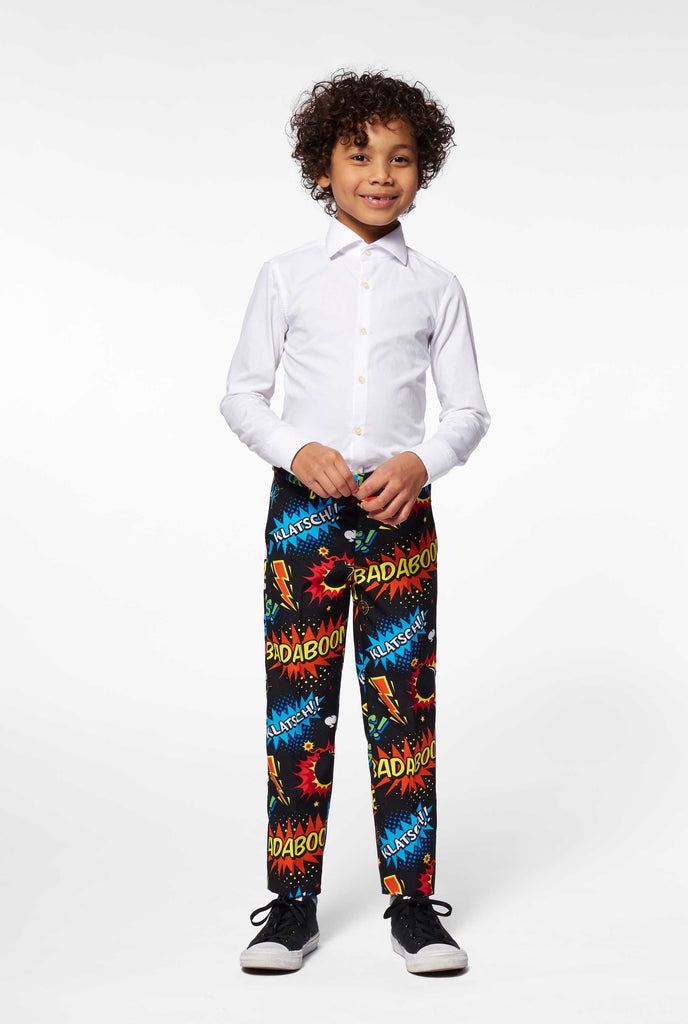 Comic book phrase pants worn by boy, part of boys suit