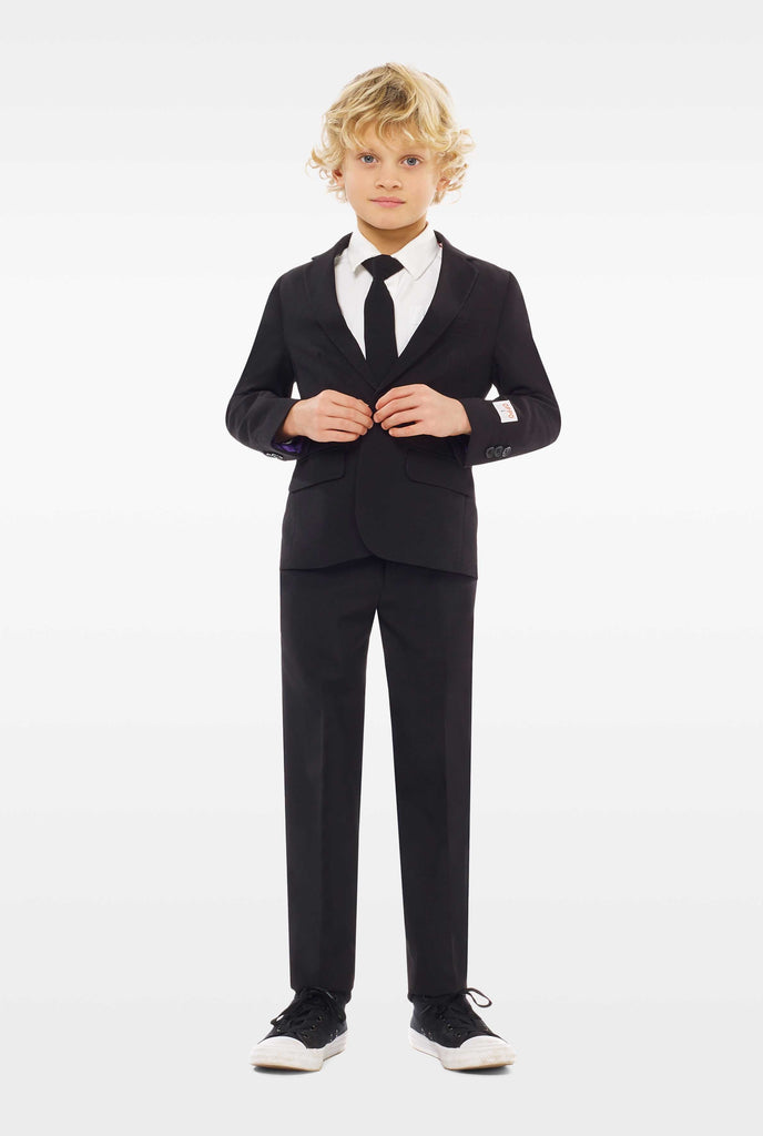 Black suit for boys worn by boy