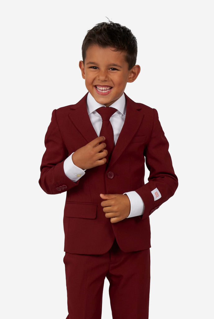 Kid wearing a burgundy red suit for boys