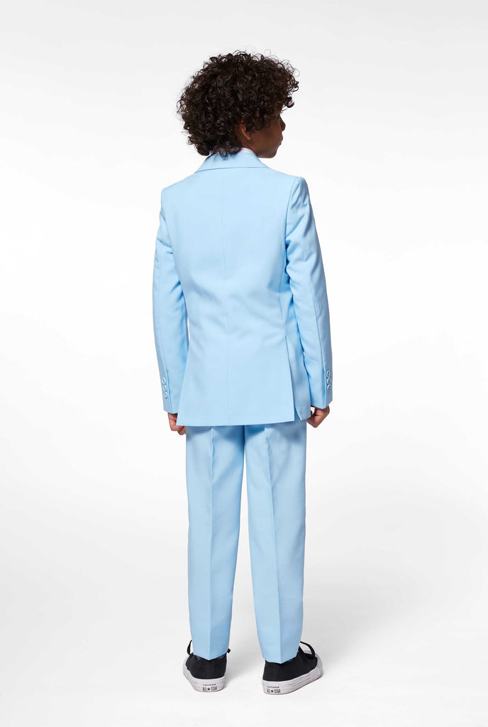 Solid colored light blue suit worn by boy backside view