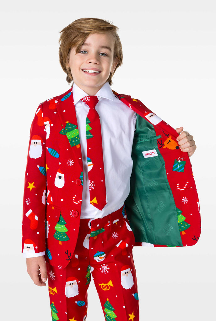 Kid wearing red Christmas suit with Christmas icons