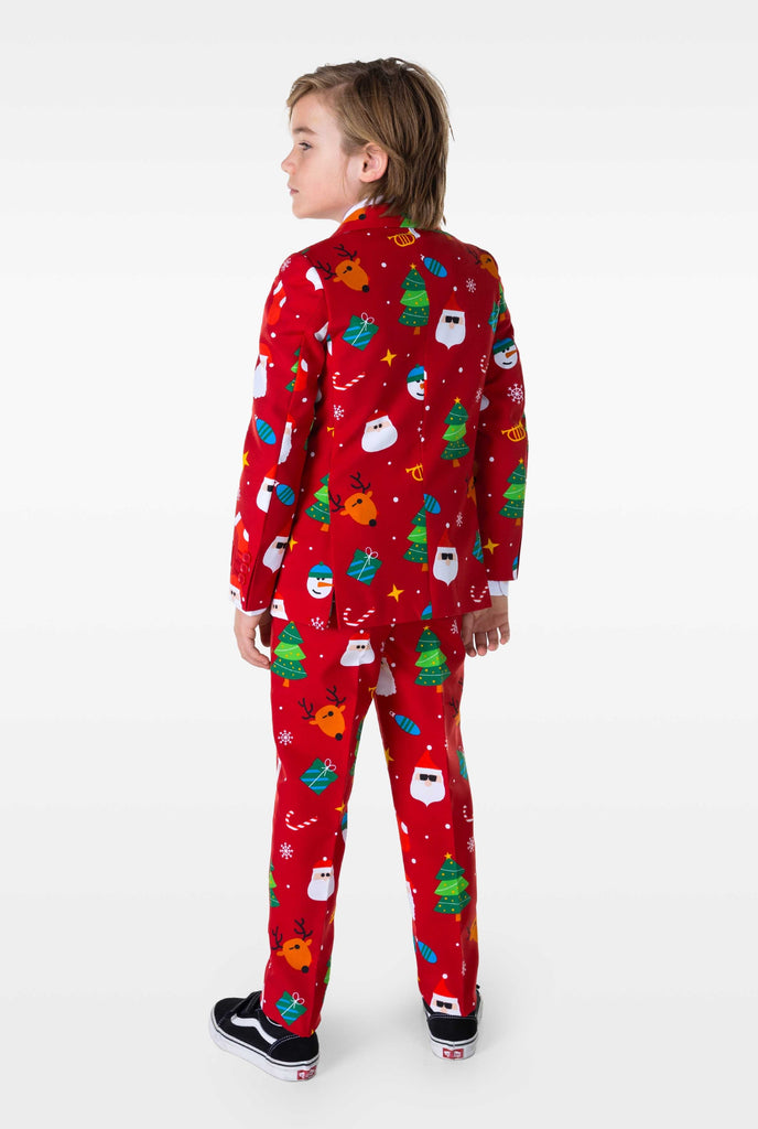 Kid wearing red Christmas suit with Christmas icons, view from the back