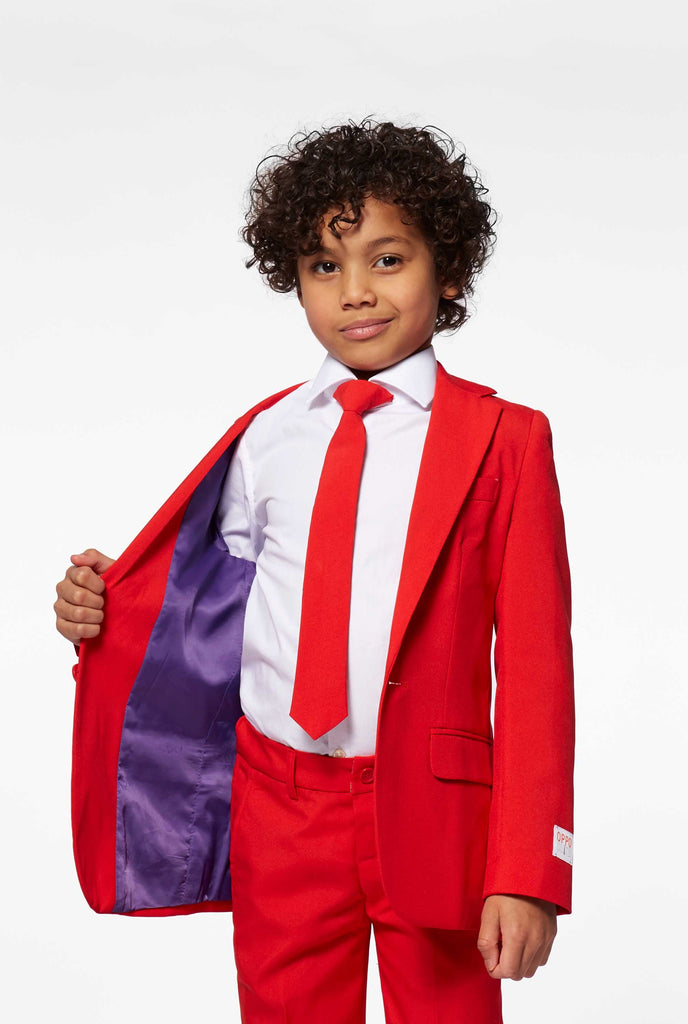 Red suit for boys worn by boy