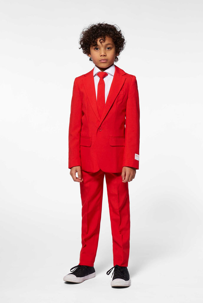 Red suit for boys worn by boy