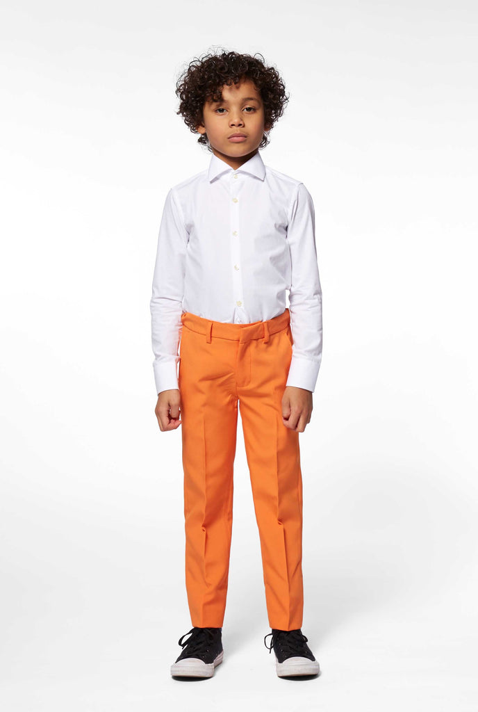 Boy wearing Solid colored orange boy suit pants