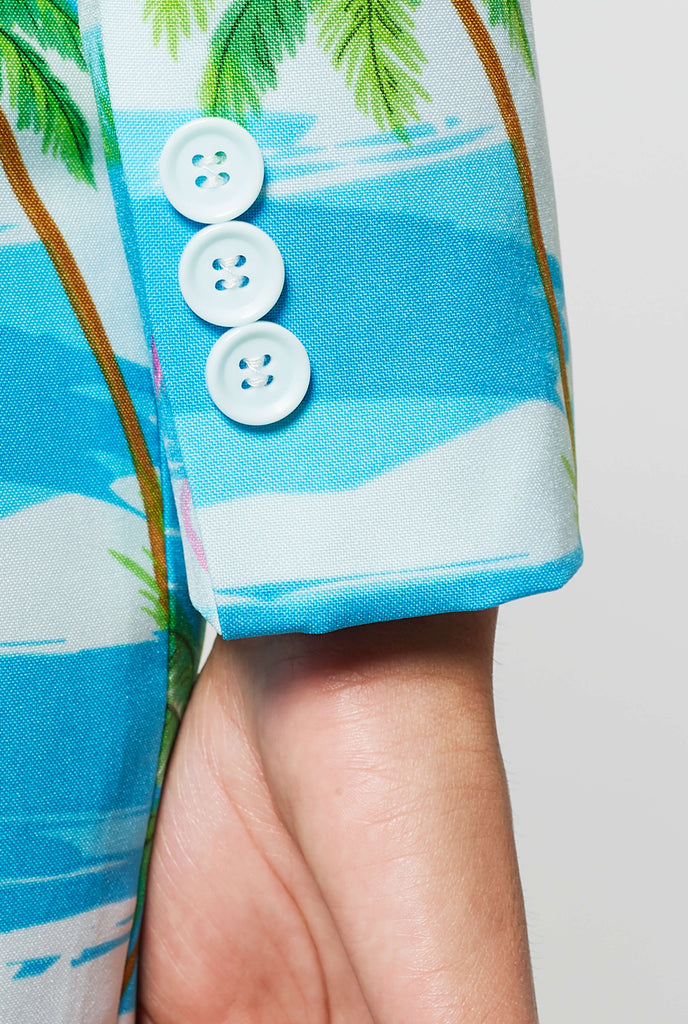 Woman wearing summer blazer with tropical flamingo print, sleeve close up