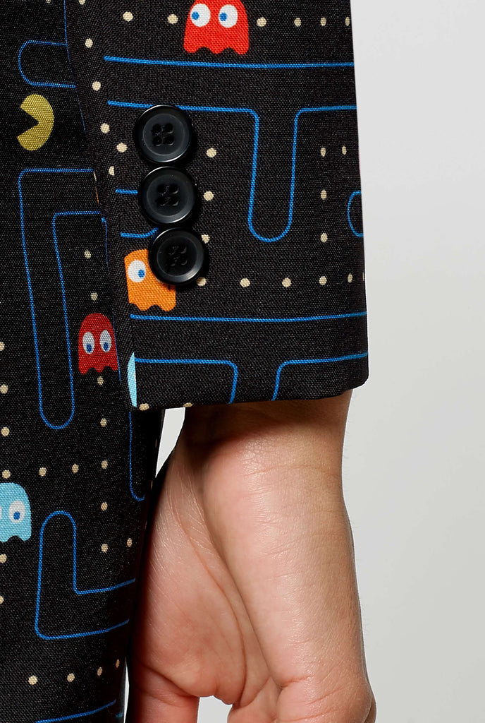 Woman wearing black blazer with Pac-Man print, sleeve close up