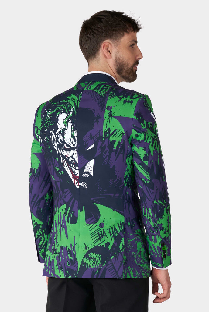 Man wearing purple and green batman vs Joker men's blazer, view from the back