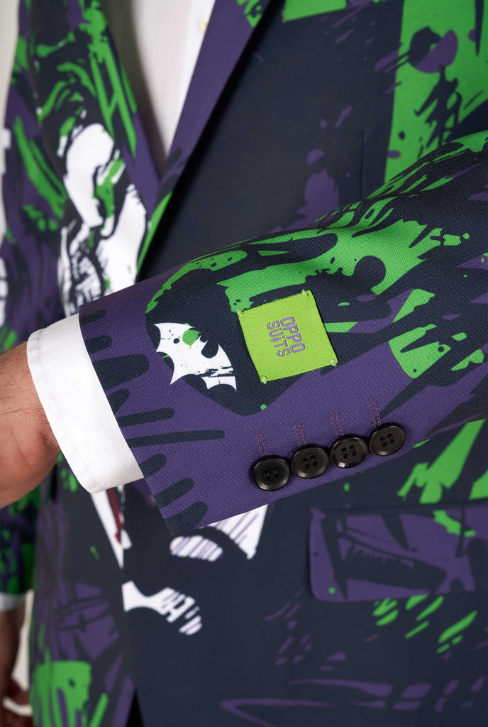 Man wearing purple and green batman vs Joker men's blazer, close up