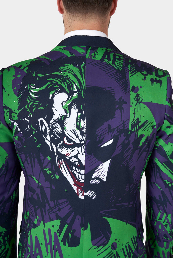 Man wearing purple and green batman vs Joker men's blazer, view from the back