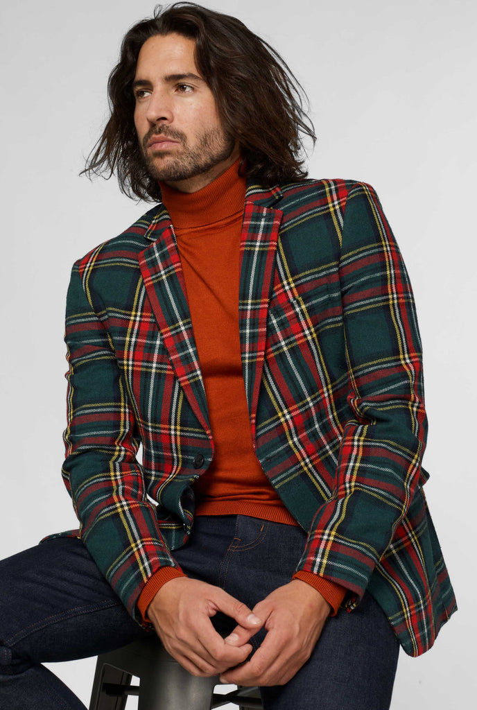 Red and green tartan blazer worn by man