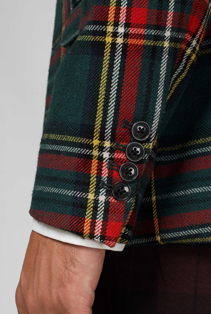 Red and green tartan blazer worn by man, sleeve close up