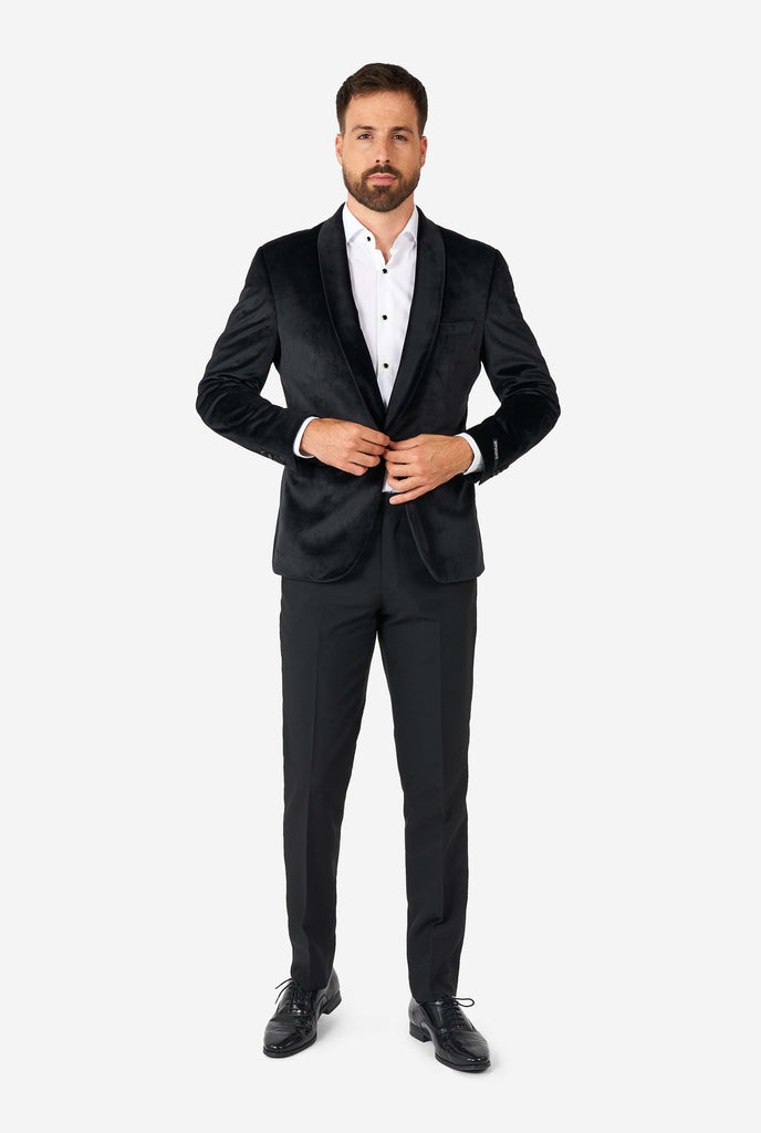 Man wearing black velvet dinner jacket blazer