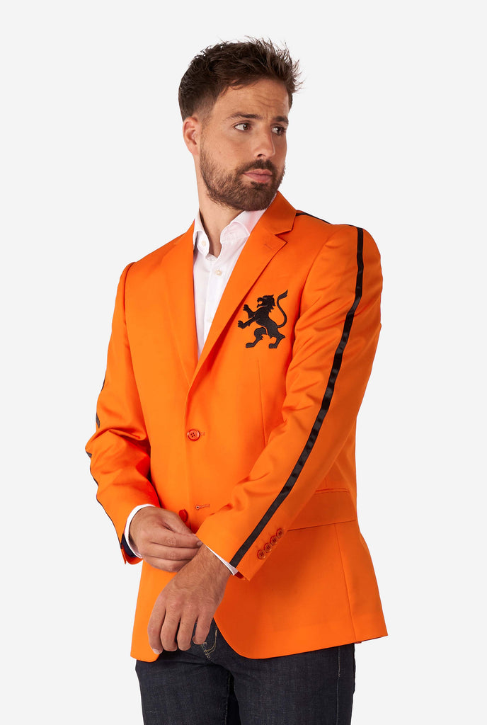 Man wearing orange blazer with dutch lion