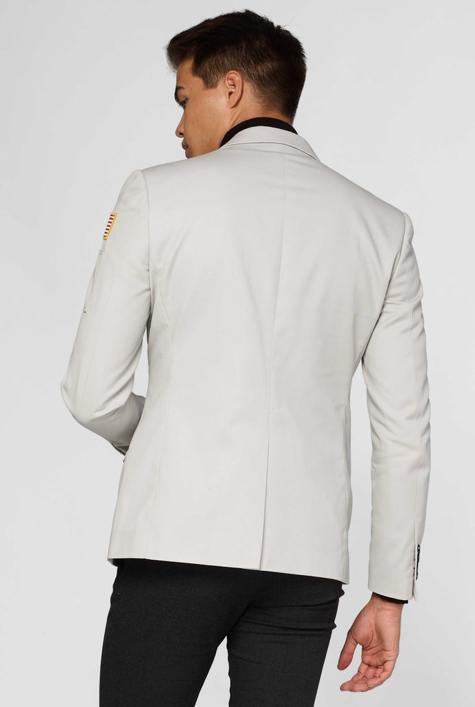 Light grey blazer with astronaut themed patches shown from behind