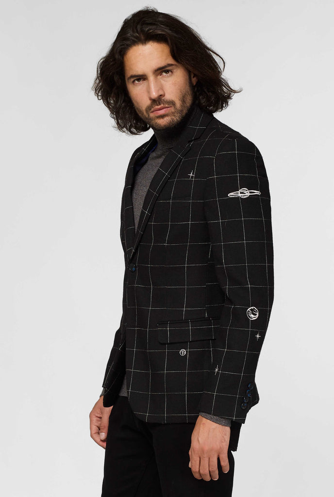 Black jacket with white grid pattern worn by man