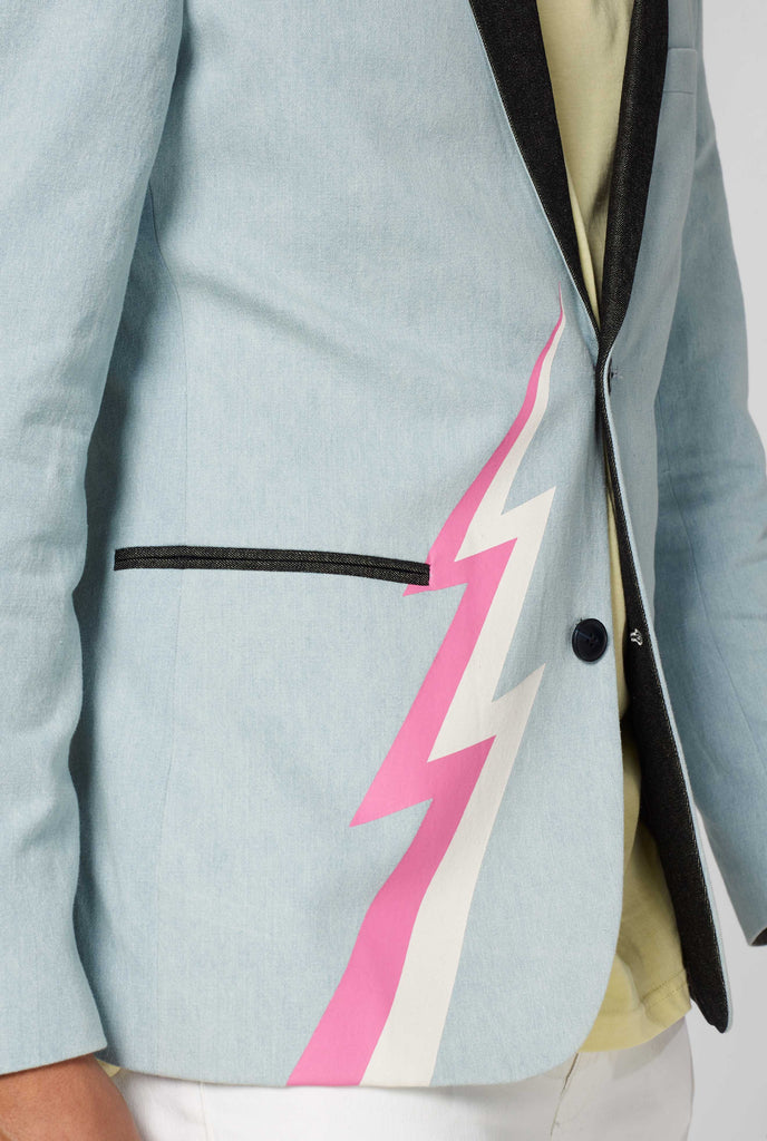 Blue casual blazer with white and pink lightning bolt worn by man shown up close