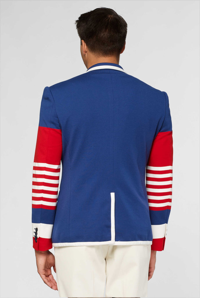 Red white and blue sporty casual blazer worn by man shown from behind