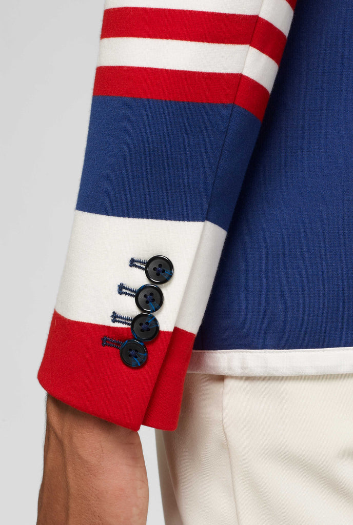 Red white and blue sporty casual blazer worn by man close up of sleeve