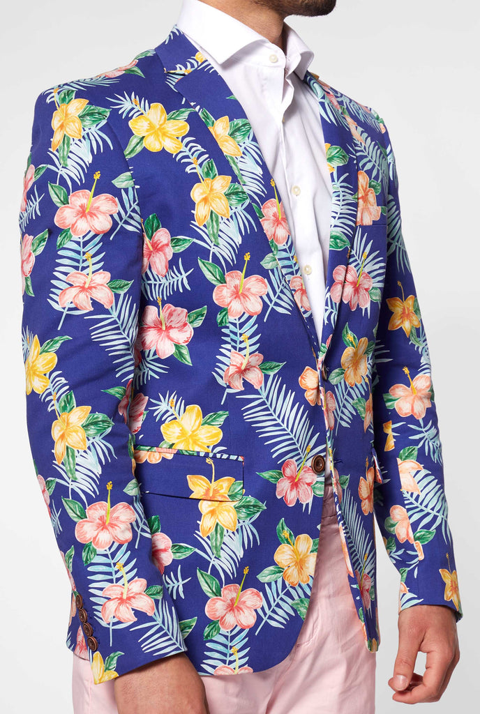 Blue blazer with flower print worn by man 