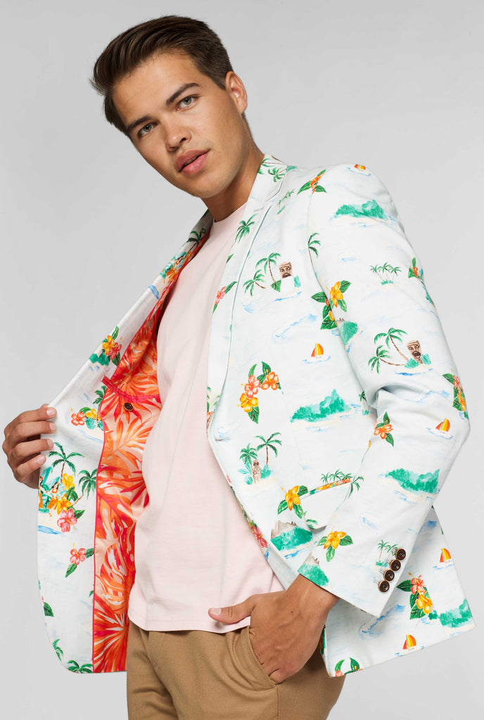 White casual blazer with Hawaiian icon print worn by man showing red palm tree inner lining