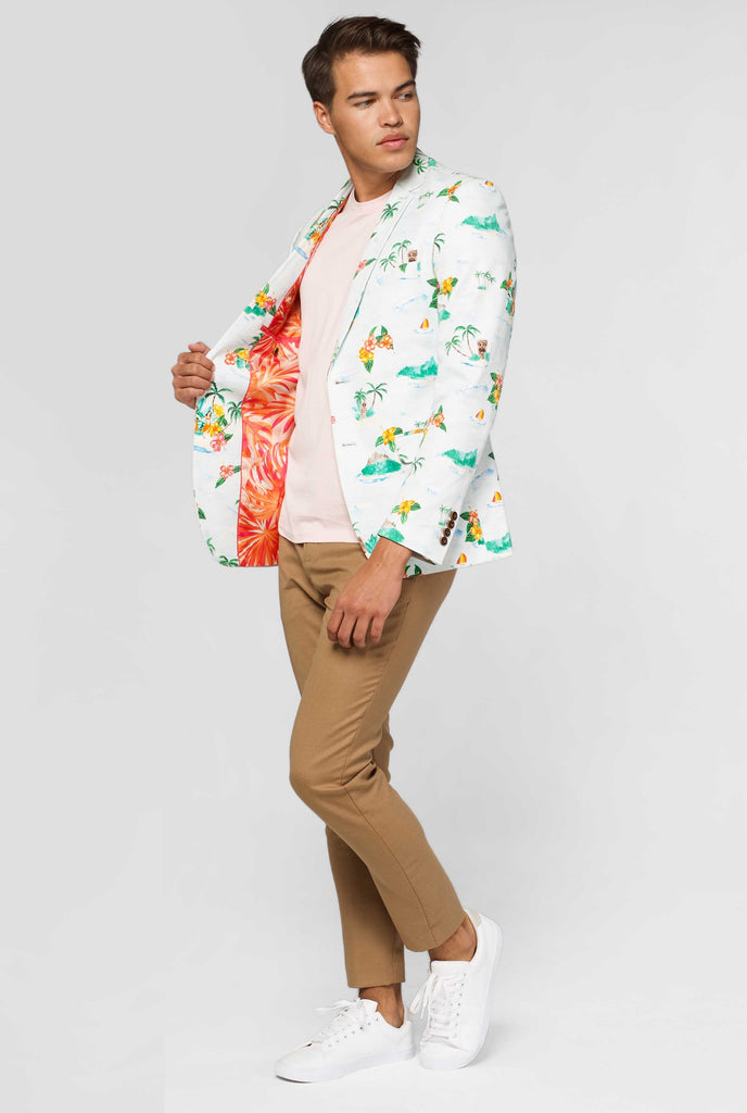 White casual blazer with Hawaiian icon print worn by man showing red palm tree inner lining