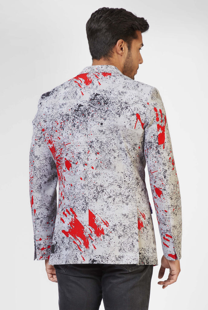 Men wearing grey Halloween blazer with blood stain print, view from the back