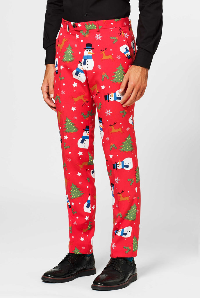 Man wearing red pants with Christmas icons 