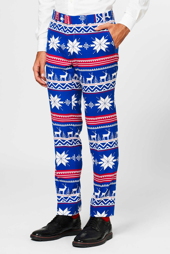 Man wearing blue pants with Nordic Christmas icons