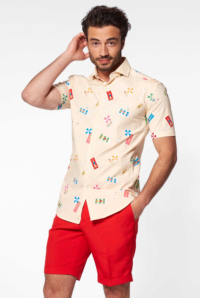 Man wearing summer shirt with beach icons