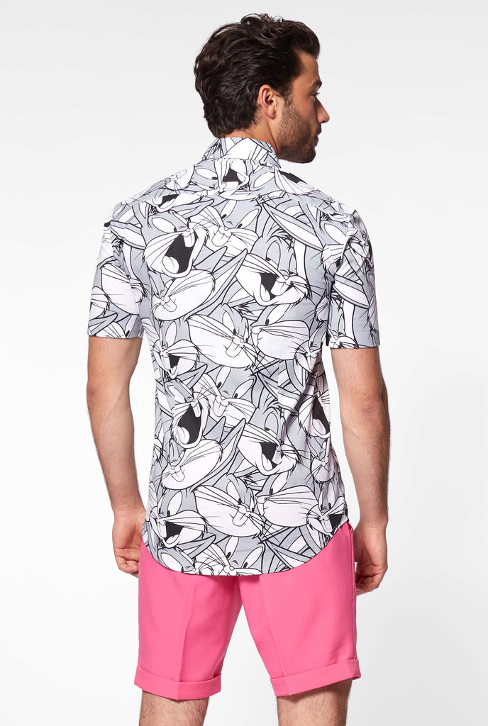 Man wearing summer shirt with bugs bunny Warner Bros print, view from the back