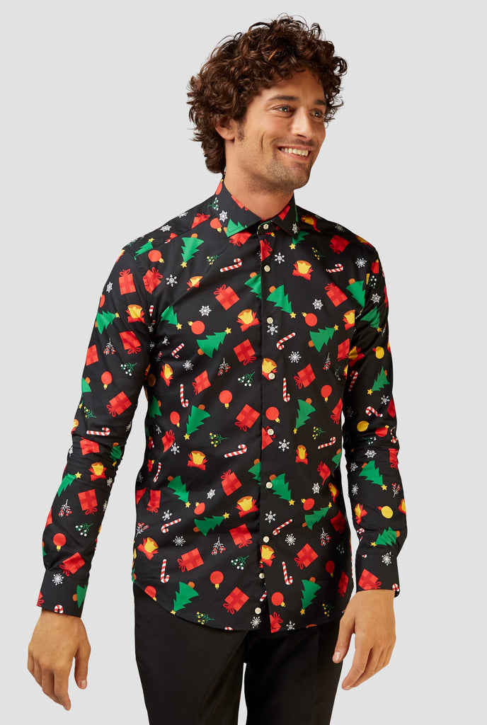 Man wearing black dress shirt with Christmas icons