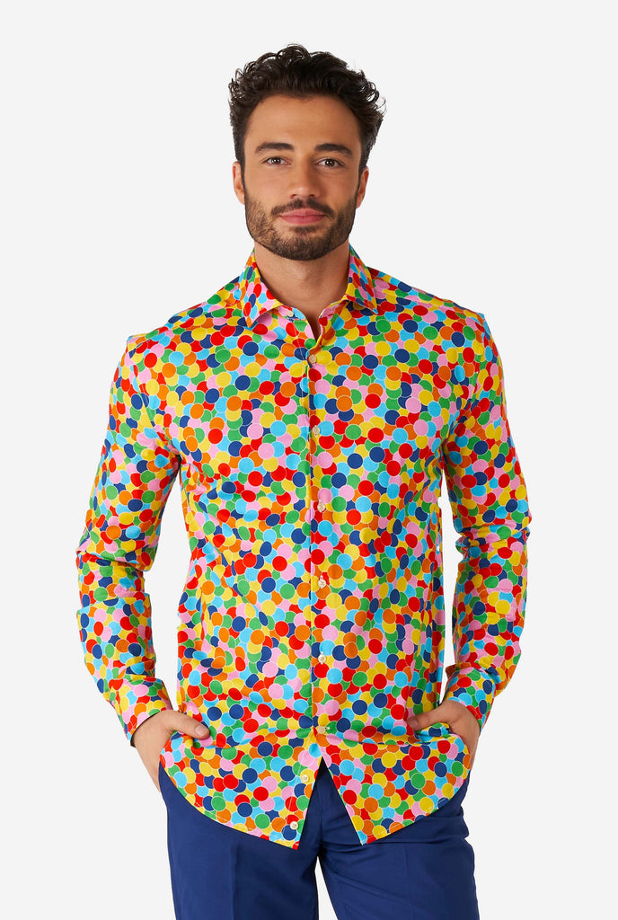 Man wearing multi color dress shirt with confetti print