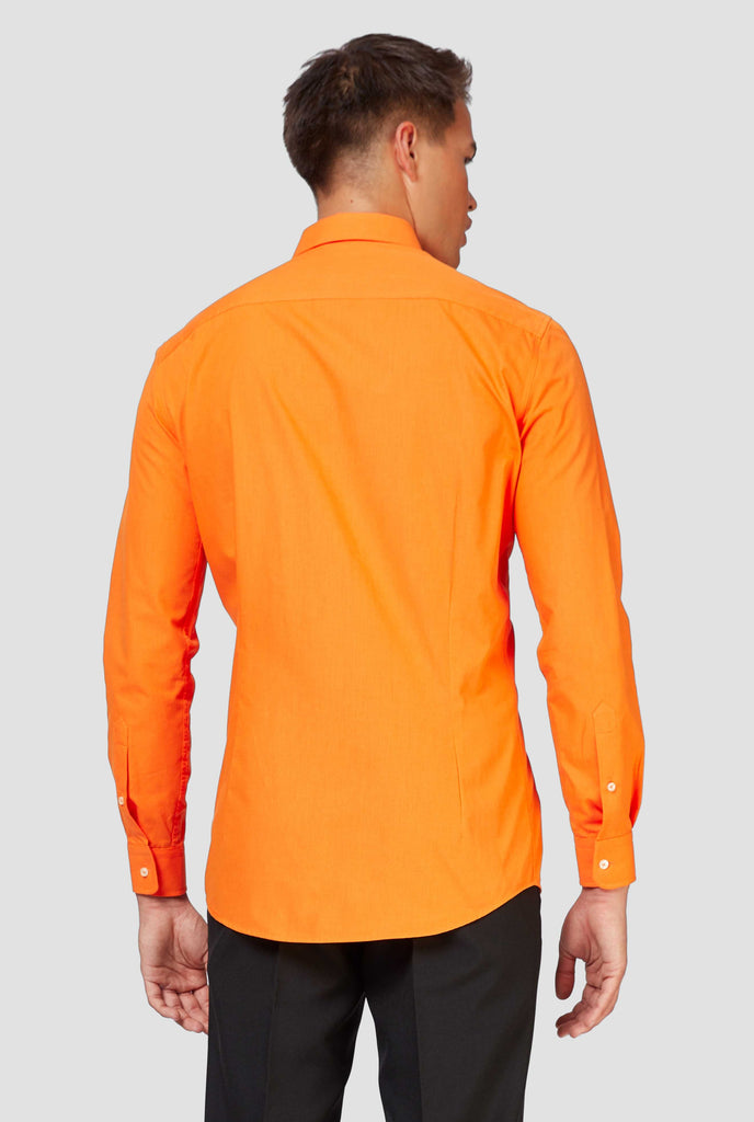 Man wearing orange dress shirt, view from the back