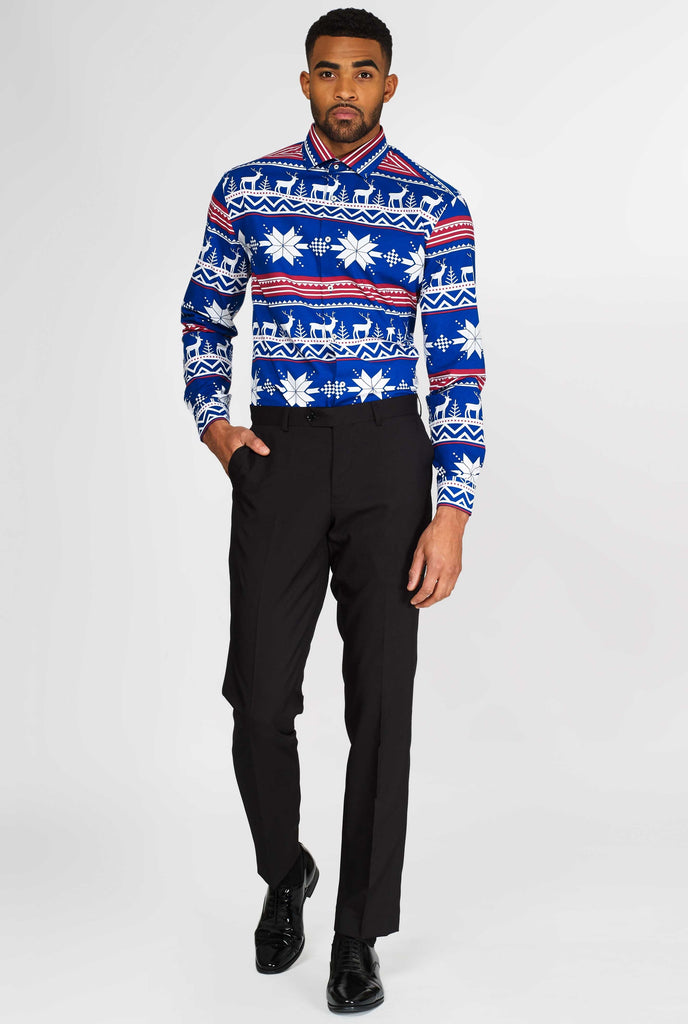 Man wearing blue dress shirt with Nordic Christmas theme