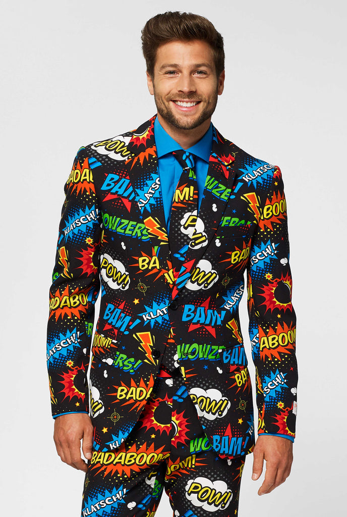 Black men's suit with comic book icons print worn by man